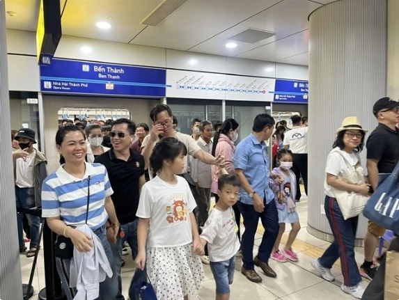 Passengers disembark at Ben Thanh station in District 1. The city's first metro commenced operations on December 22, following 17 years of planning and 12 years of construction.