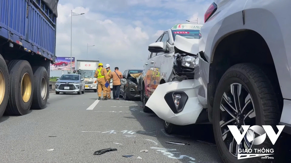 Traffic police handle a car accident on a national highway in Vietnam