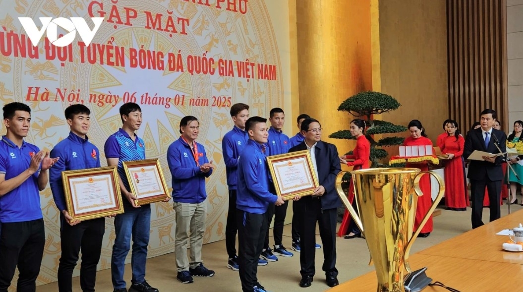 The Government chief presents Certificates of Merit to 29 members of the national squad.