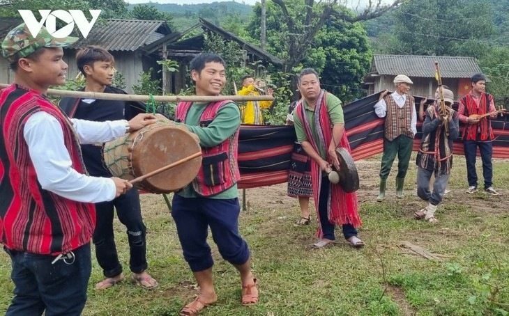 People dance to the rhythm of gongs, drums, and panpipes.