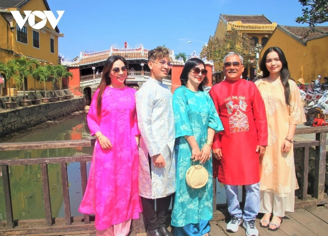 Tourists gather at the historic site of Chua Cau (Japanese Covered Bridge), a major tourist attraction in Hoi An.