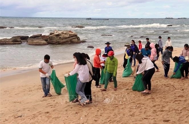 People collect plastic waste at Dinh Cau beach, Phu Quoc district, Kien Giang.