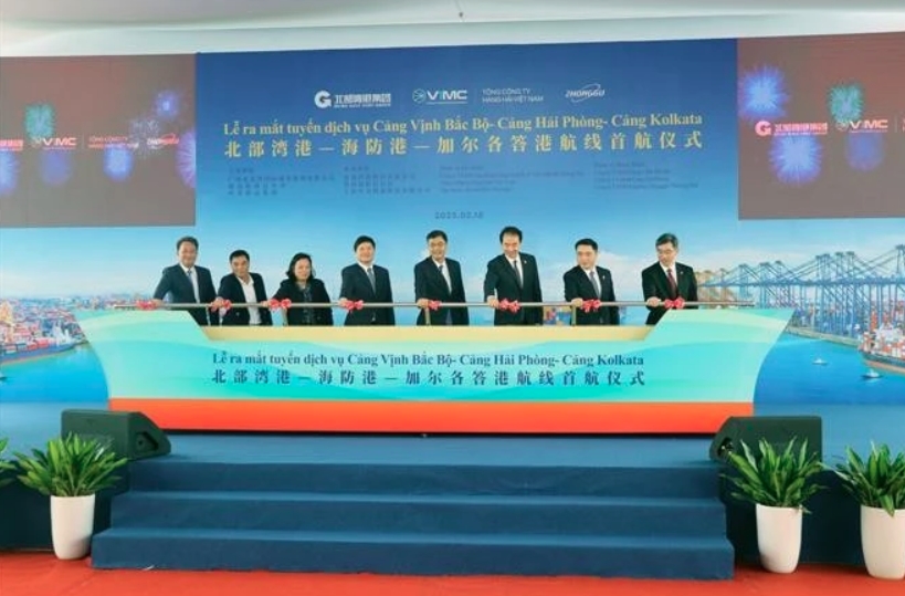 Delegates mark the launch of the new shipping route on February 18.