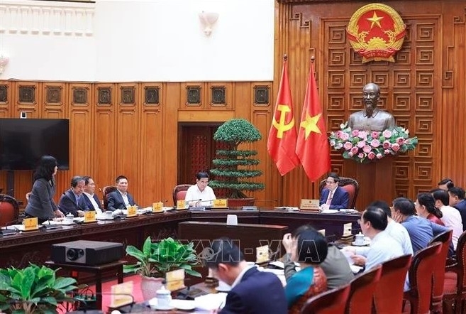 PM Pham Minh Chinh chairs a government meeting with the Ministries of Education and Training, and Health in Hanoi on March 25