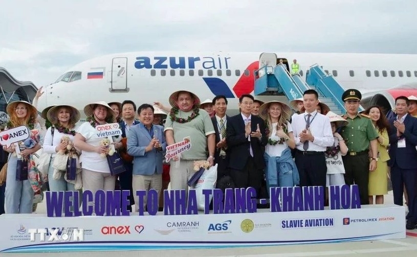 Russian tourists are welcomed at Cam Ranh airport in Khanh Hoa province.