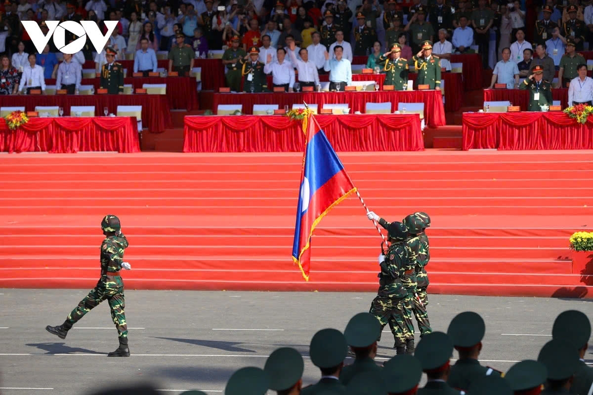 Troops from the People’s Army of Laos join the marching.