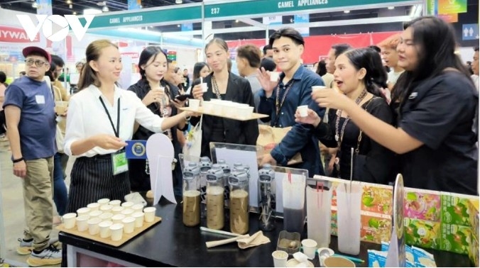 Visitors try Vietnamese products at the event
