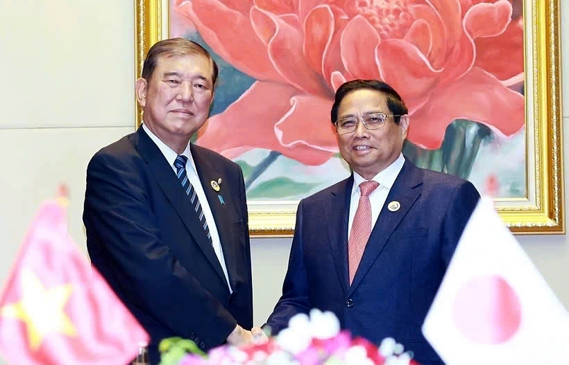 Vietnamese Prime Minister Pham Minh Chinh (R) and Japanese Prime Minister Shigeru Ishiba meet in Vientiane, Laos, on the sidelines of ASEAN Summits 44-45 in October 2024
