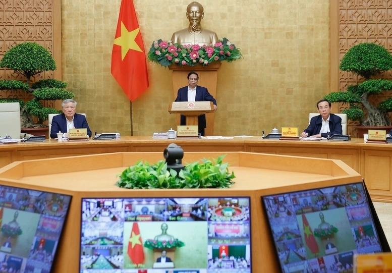 Prime Minister Pham Minh Chinh chairs a Government monthly meeting for March in Hanoi recently.