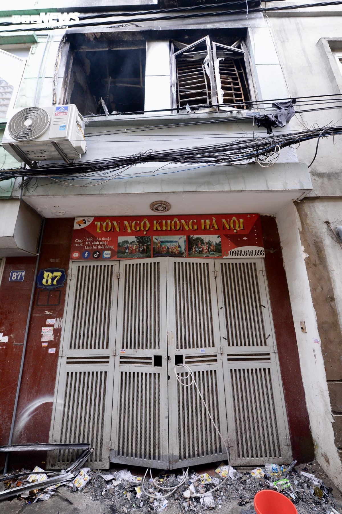 Second-floor window deformed by fire heat