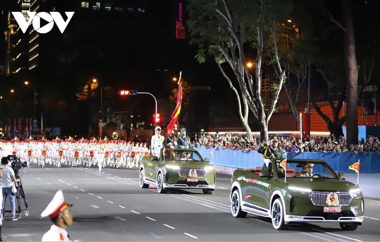 The command vehicle and the military flag vehicle enter the grandstand area.