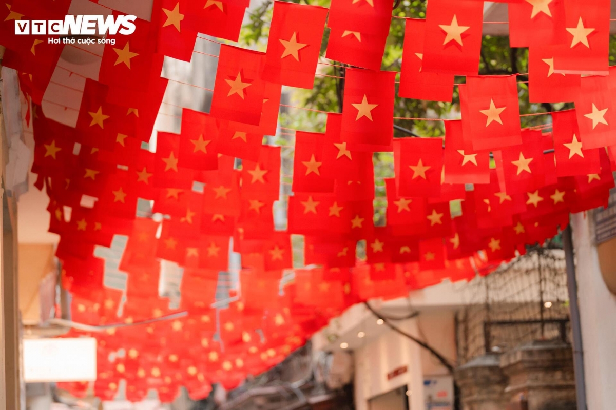 Dang Thai Than Street in Hanoi is decorated with national flags.