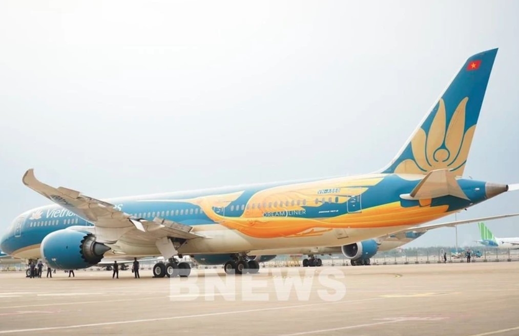 The Boeing 787-9 Dreamliner with special livery featuring the chim Lac