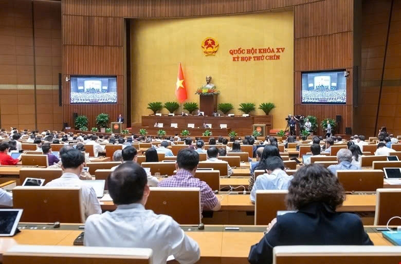 Deputies attend a plenary session of the National Assembly in Hanoi