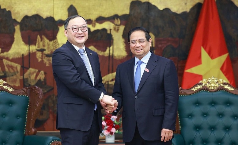 Prime Minister Pham Minh Chinh welcomes Zhou Jiayi, President of PowerChina Asia Pacific (Photo:VGP)