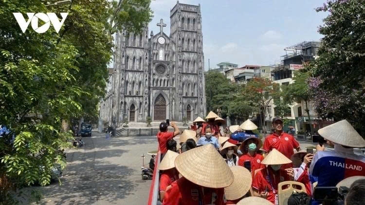 Tourists visit St. Joseph's Cathedral in Hanoi.