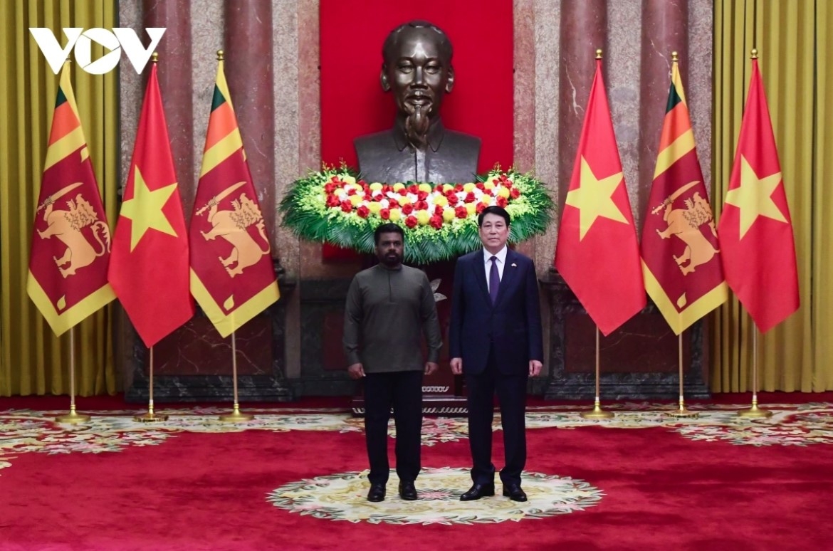 They pose for a photo.