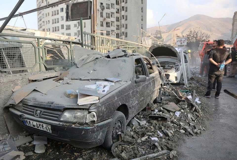 Cars in Tehran have been severely damaged by Israel's air strikes on June 13. (Photo: WANA/Reuters)