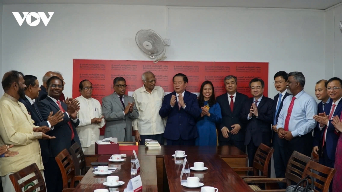 Vietnamese Communist Party officials and Sri Lankan Communist Party officials pose for a group photo during their meeting in Colombo on June 2