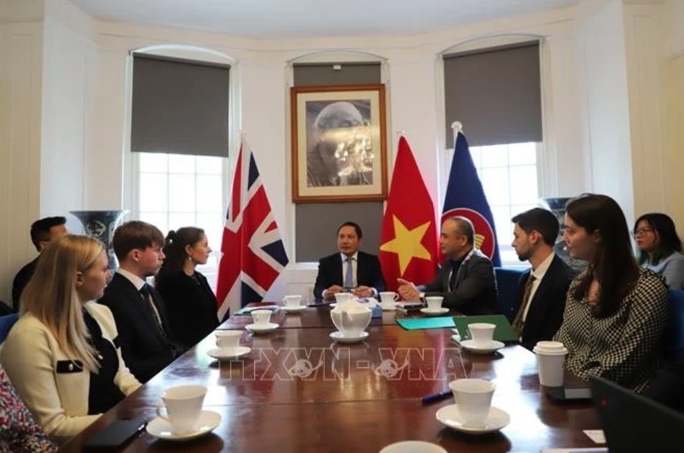 Vietnamese Ambassador to the UK Do Minh Hung (centre) delivers the opening remarks at the workshop in London on June 9.
