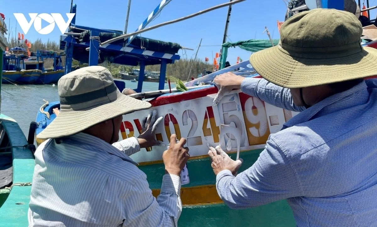 Vessel identification numbers are attached to the hulls of fishing boats to monitor their entry and exit activities in Ba Ria – Vung Tau