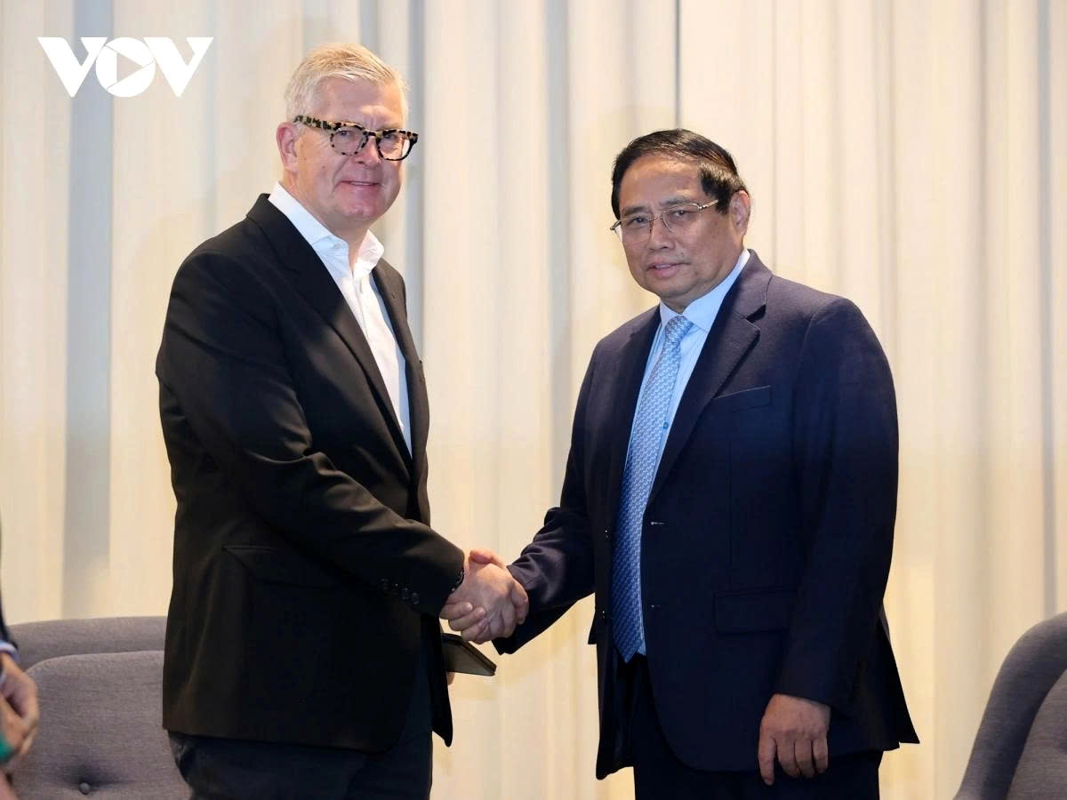 Vietnamese Prime Minister Pham Minh Chinh (R) receives Ericsson CEO Borje Ekholm in Stockholm, Sweden, on June 13, 2025 during his official visit to Sweden