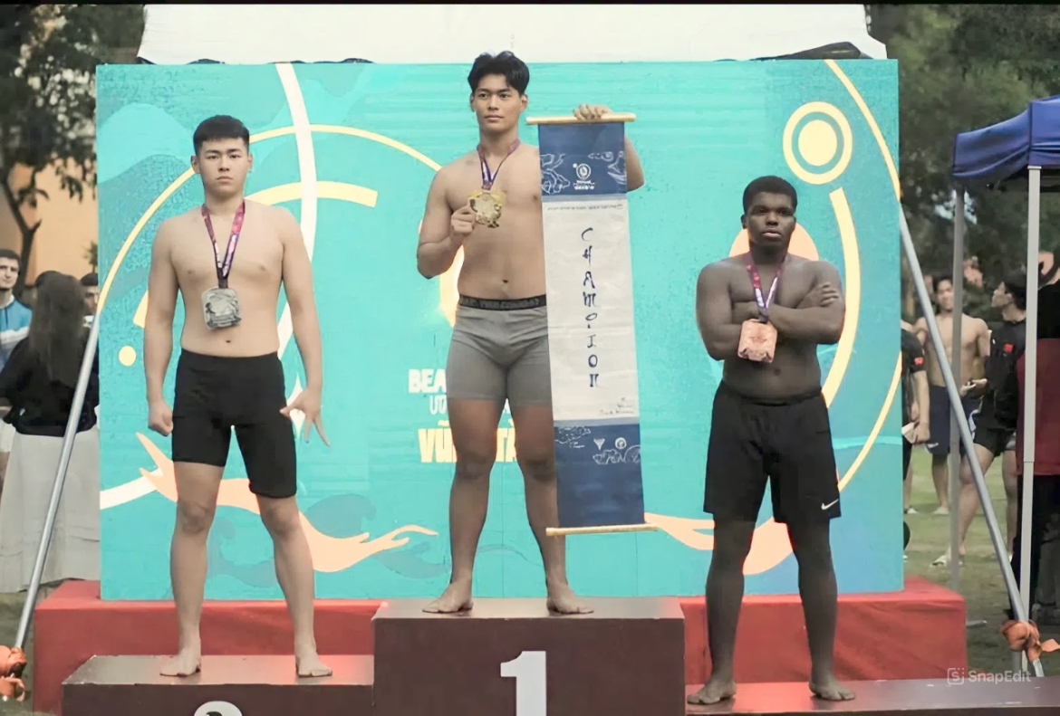 Minh Hieu (centre) wins gold in the beach wrestling category at U17 and U23 Asian Wrestling Championships