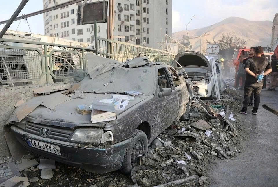 Cars in Tehran have been severely damaged by Israel's air strikes on June 13. (Photo: WANA/Reuters)