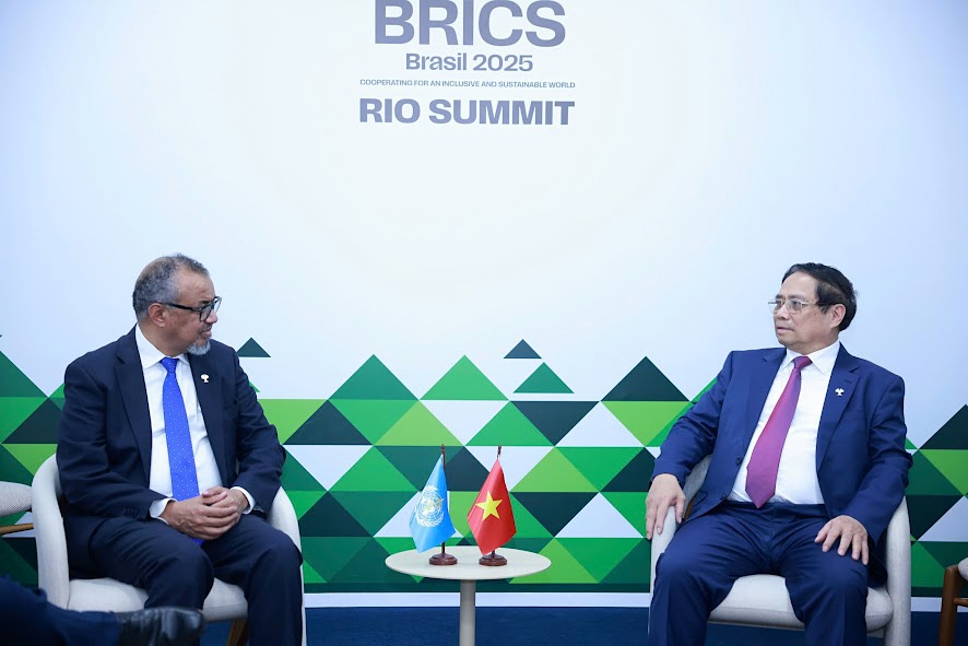 Vietnamese Prime Minister Pham Minh Chinh (R) and WHO Director-General Dr. Tedros Adhanom Ghebreyesus during their meeting in Rio de Janeiro, Brazil, on July 6