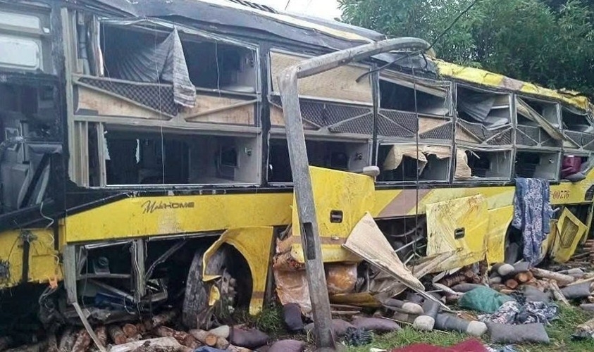The bus is severely damaged following the crash