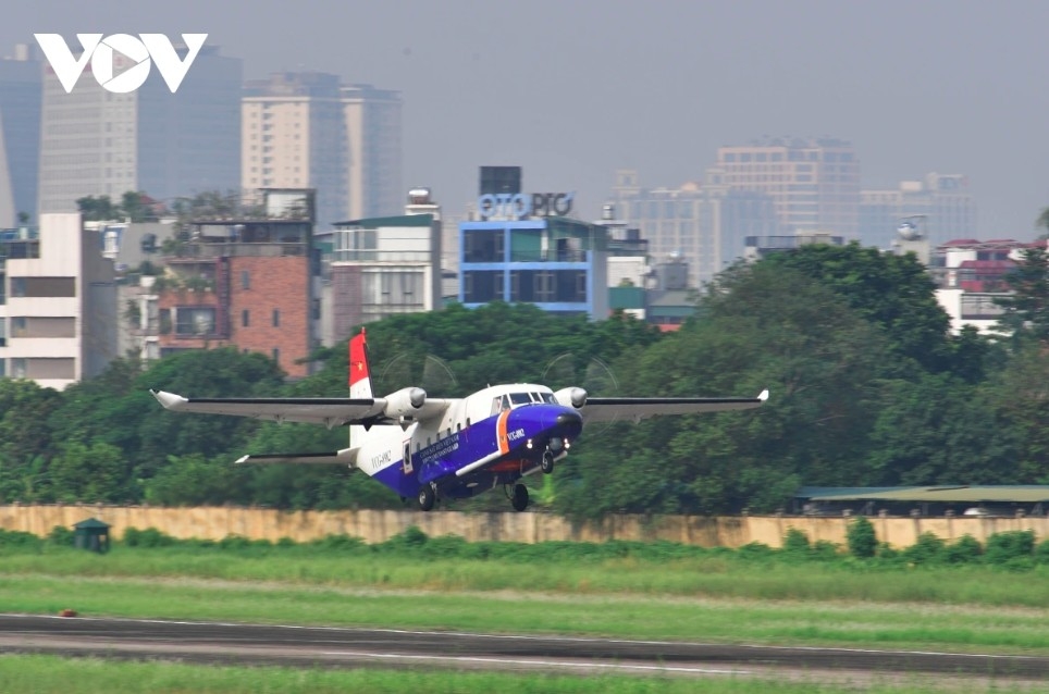 C212-400 takes off from Gia Lam Airport to join A-formation flight with two C212i aircraft