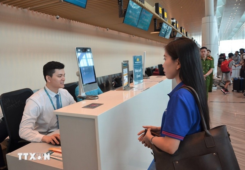 Passengers undergo facial recognition during the check-in process.