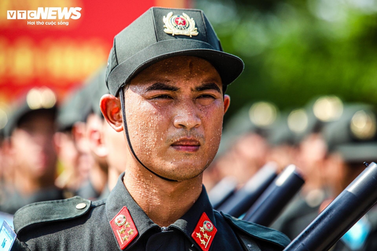 "The heat is extremely harsh, but it is my great honour to be selected as part of the unit for the grand celebration, so we put in twice or even three times the usual effort,” says a male officer from the mobile police unit.