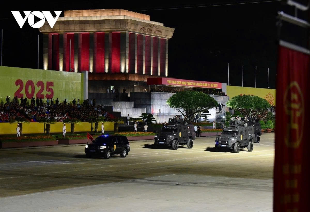 The police force’s specialised vehicle unit marches past the grand stand.