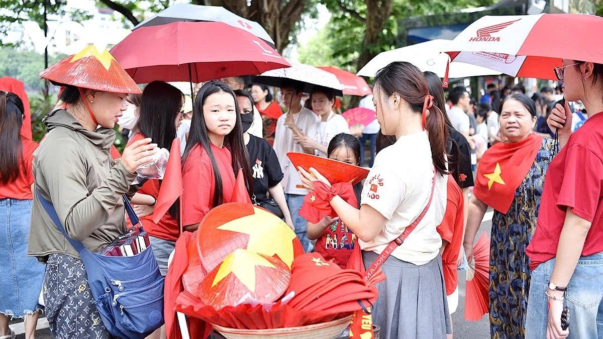 Hats, caps, scarves, t-shirts, and other items adorned with the red flag and yellow star colour the pedestrian streets around Hoan Kiem Lake and many historical and revolutionary sites throughout the capital city.
