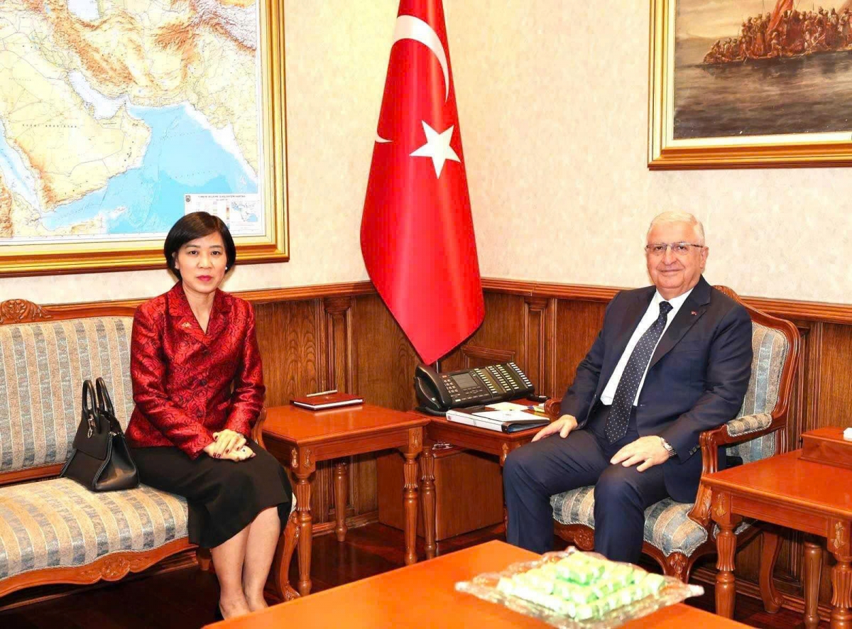 Turkish Minister of National Defence Yaşar Guler (R) receives Vietnamese Ambassador Dang Thi Thu Ha
