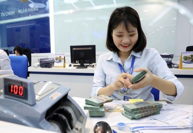 As of July 28, the total outstanding loan rises by 9.64% compared to the end of last year. (Photo: VNA)