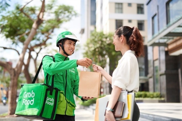 GrabMart, Grab's online grocery platform, positions itself as an express shopping assistant. (Photo: VNA)