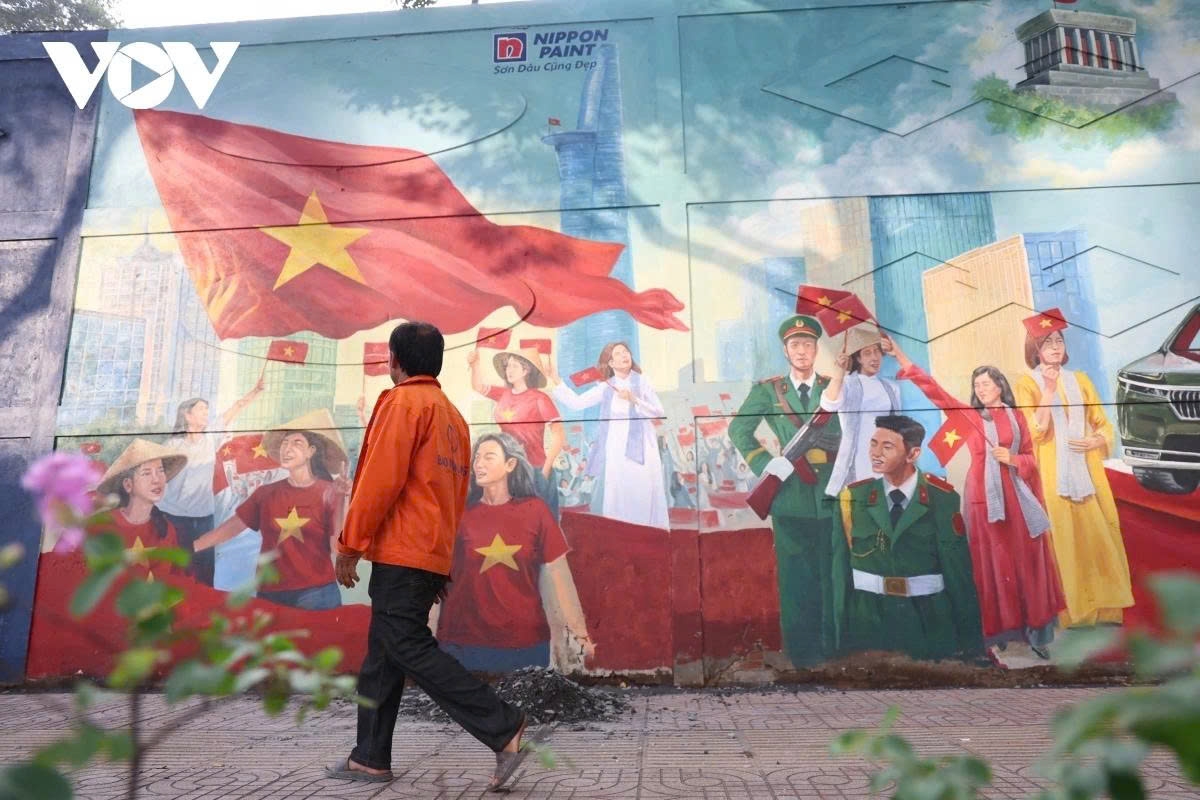 At the end of the painting, an image of veterans and armed forces walking among civilians symbolises the enduring values of peace and unity.
