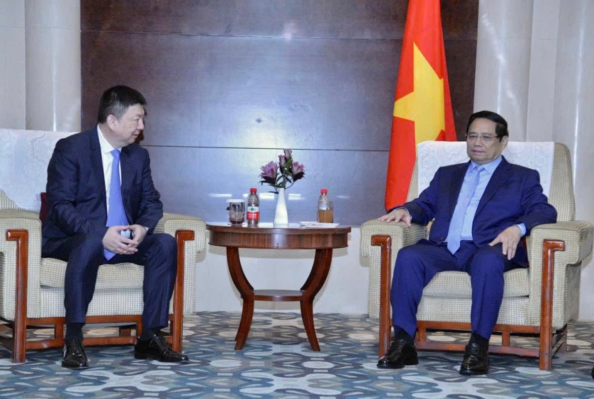 Vietnamese Prime Minister Pham Minh Chinh (R) and Chairman at China Design Group Co. Ltd. (Huatie) Yang Weidong, during their meeting in Tianjin, China, on August 31