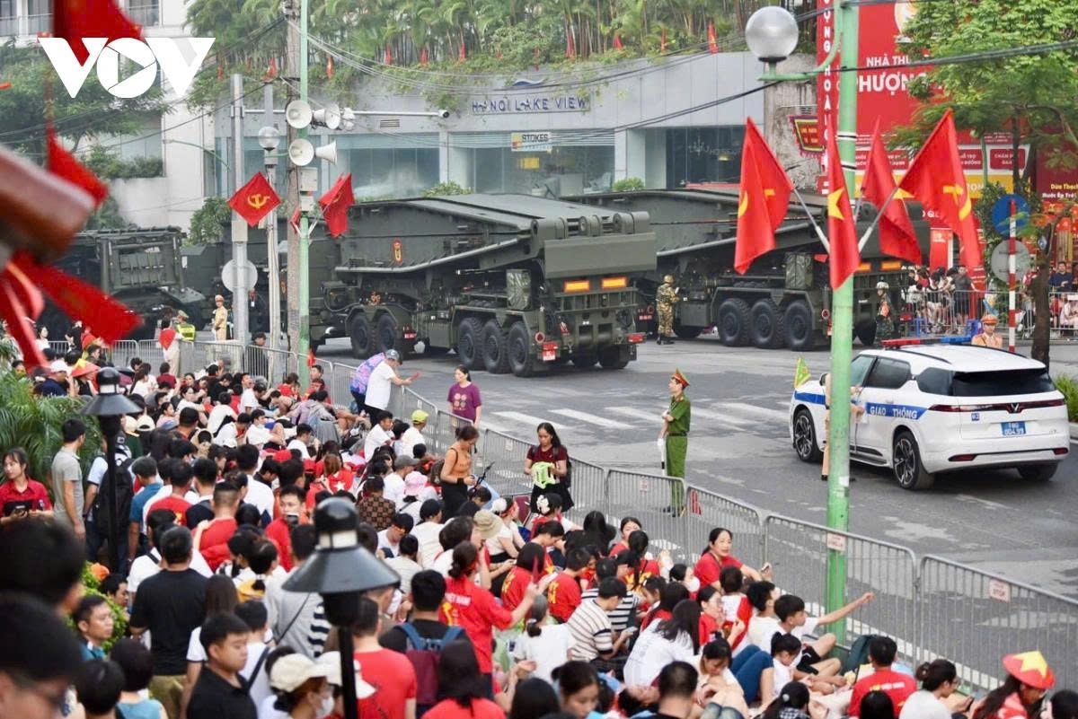 Crowds cheer as the parade units march toward the grand stand at Ba Dinh Square