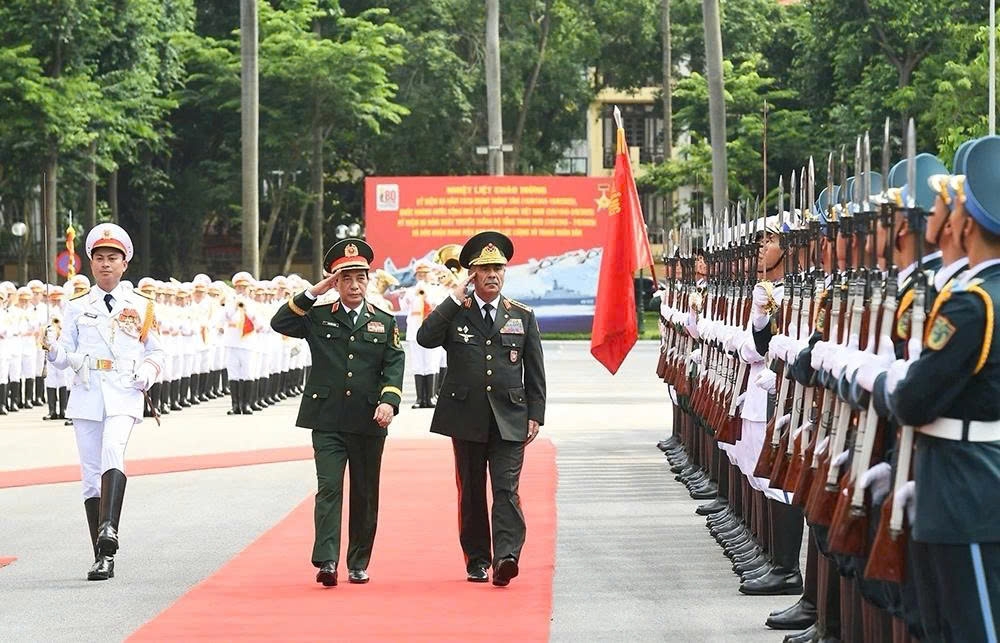 General Phan Van Giang (L), Minister of National Defence of Vietnam, and Colonel General Zakir Hasanov, Minister of Defence of Azerbaijan, review the guard of honour in Hanoi on September 4