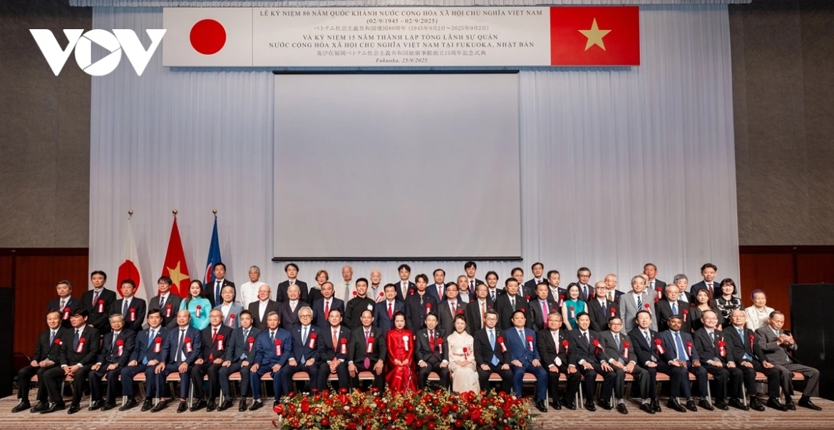 Delegates pose for a group photo at the ceremony