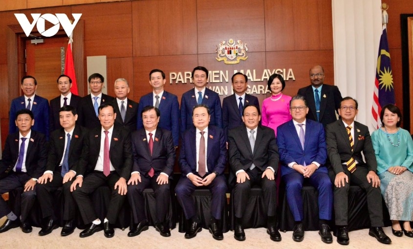Delegates pose for a commemorative photo