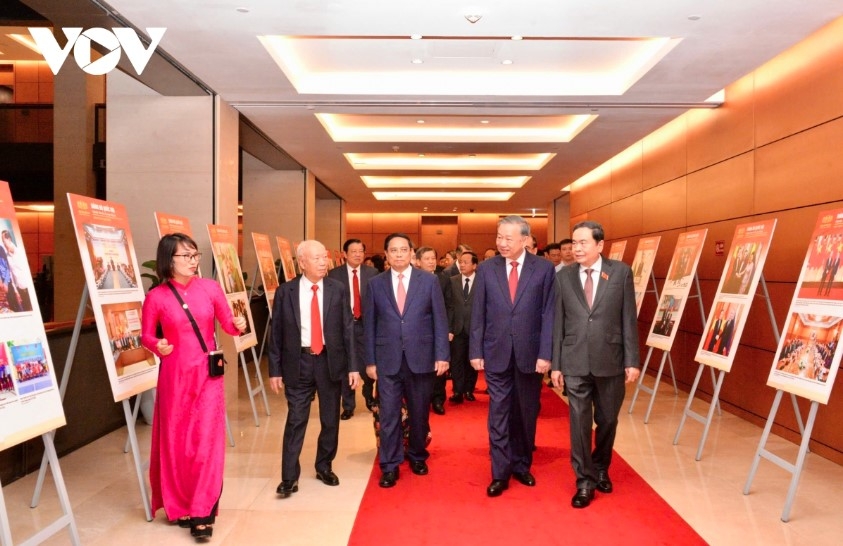 Party General Secretary To Lam and incumbent and former Party and State leaders visit an exhibition at the National Assembly House