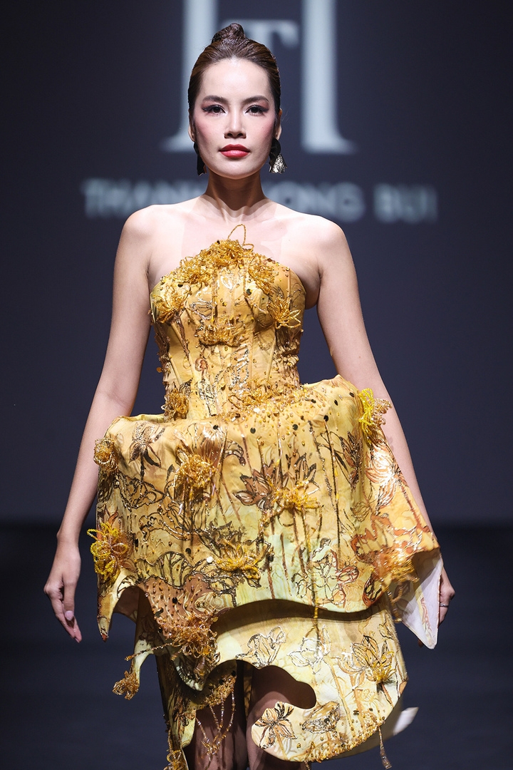 Miss Grand Vietnam 2023 Le Hoang Phuong opens the show in an outfit inspired by traditional Vietnamese papermaking techniques, featuring 3D silhouettes and intricate beaded floral embroidery.