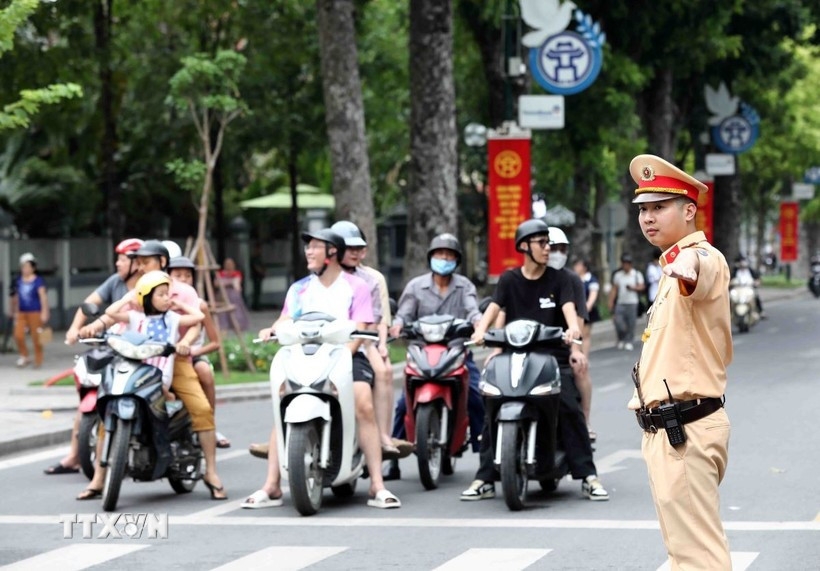 A traffic policeman regulates the traffic flow in Hanoi.