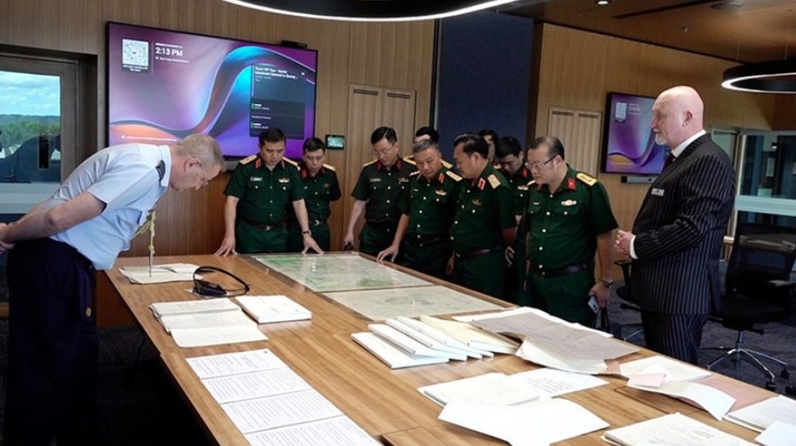 National Steering Committee 515 holds a working session with the Australian Army's Unrecovered War Casualties Unit. (Photo: qdnd.vn)