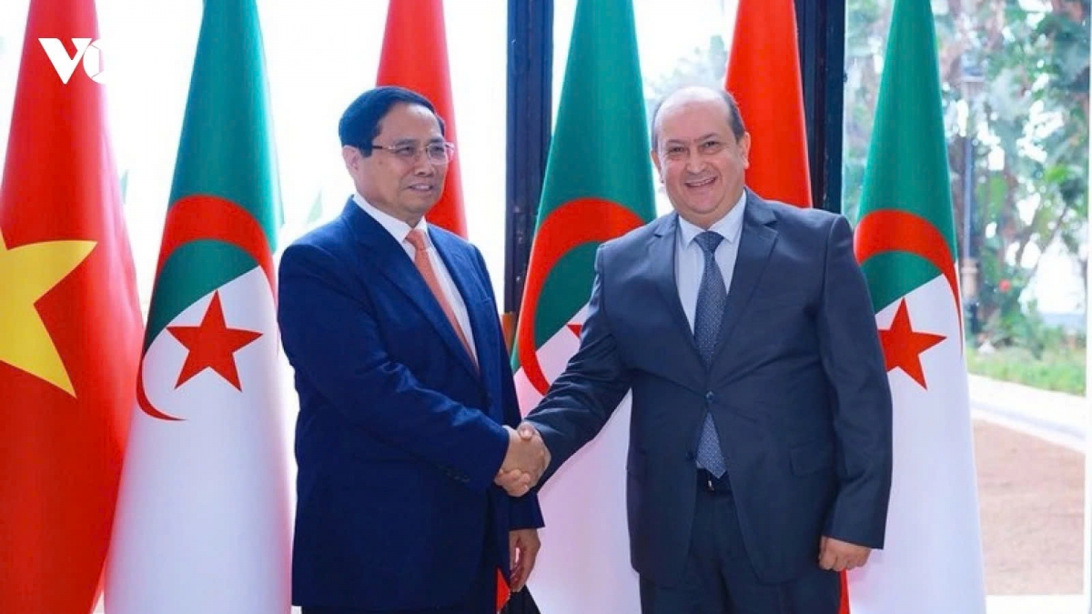 Algerian Prime Minister Sifi Ghrieb and his visiting Vietnamese counterpart Pham Minh Chinh shake hands ahead of their talks in capital Algiers on November 19