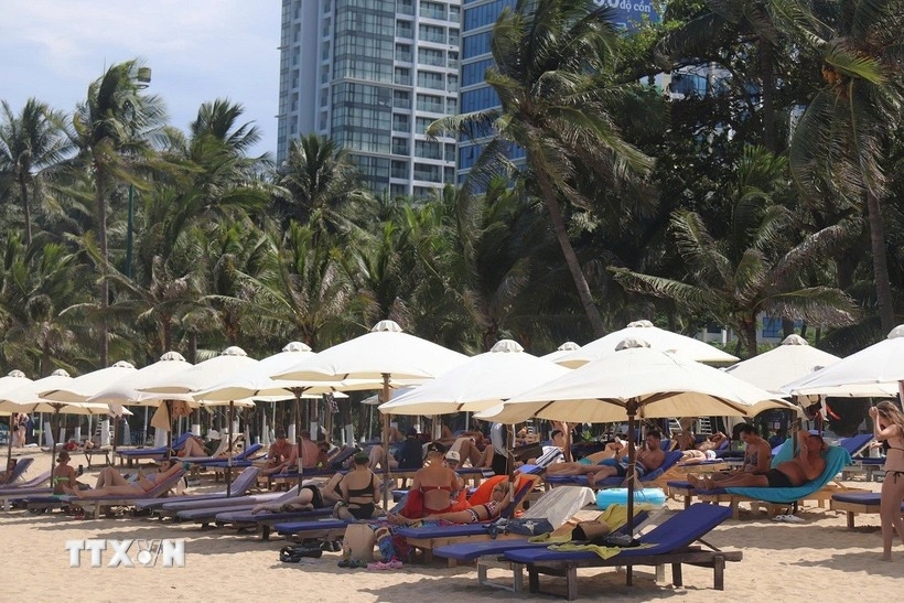 Russian visitors enjoy the beach in Nha Trang